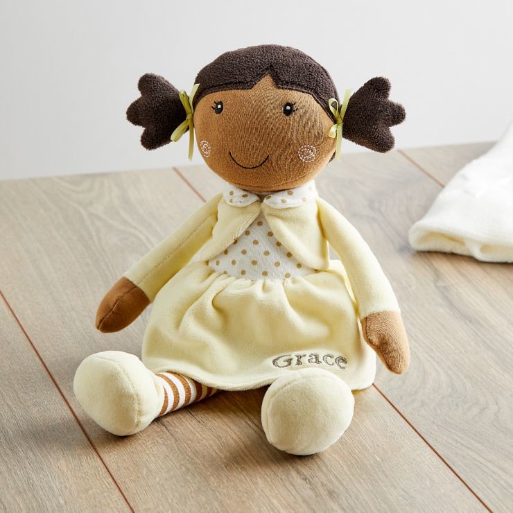 Rag doll wearing pale yellow outfit.