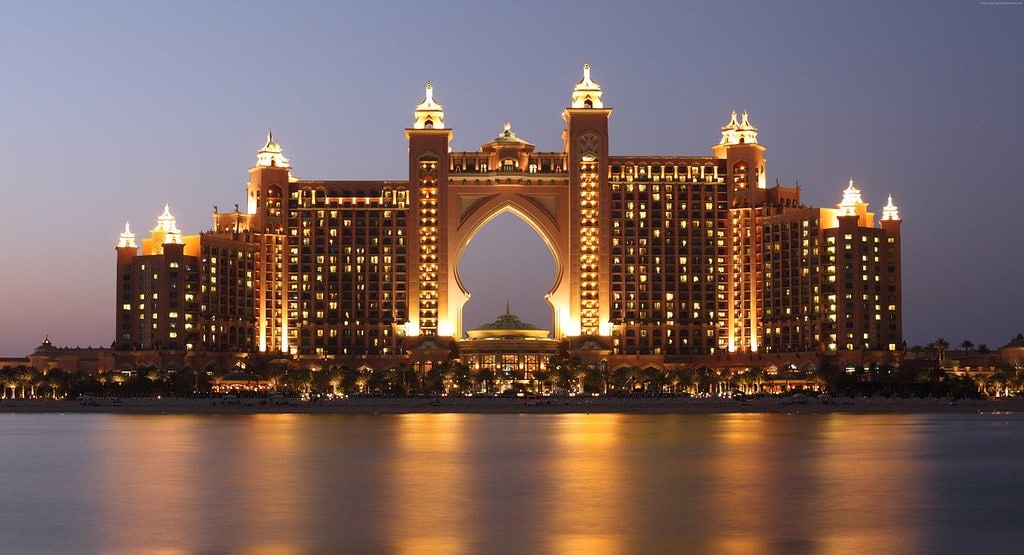 The luxury Atlantis The Palm hotel in Dubai, lit up at night time.