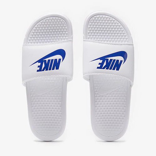 White Nike Benassi Slides.