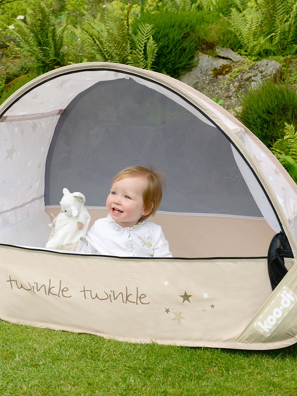 Baby in the Koo-di Sun And Sleep Pop Up Cot.