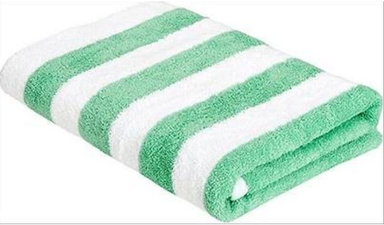 Green and white Amazon Basics Beach Towel by Amazon.