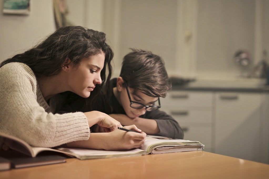 Mum and son sat at the table studying the WW2 timeline.