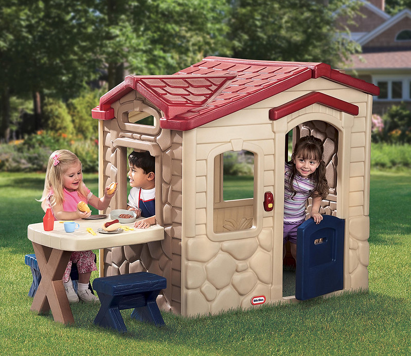Children playing in the Little Tikes Picnic On The Patio. Playhouse.