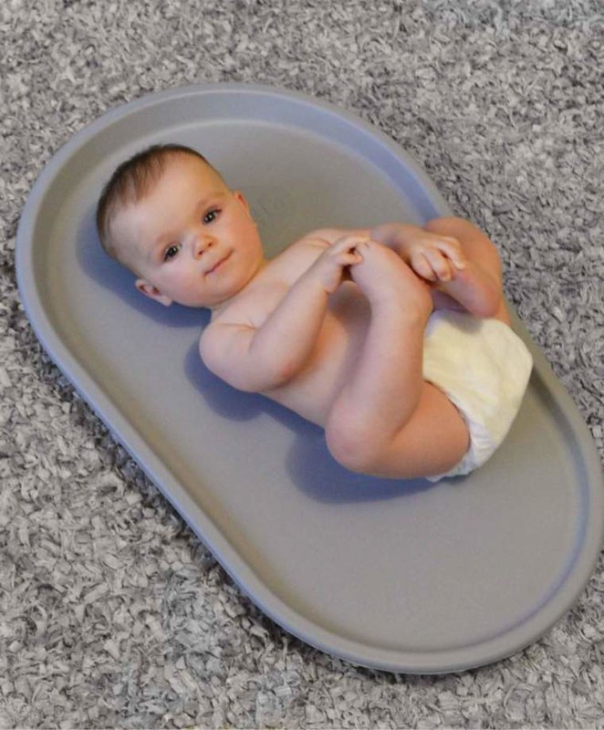 Baby on Shnuggle Squishy Changing Mat.