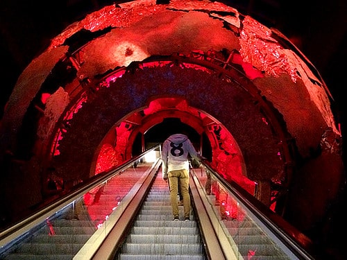 The escalator at the Science Museum takes you through a giant metallic globe.