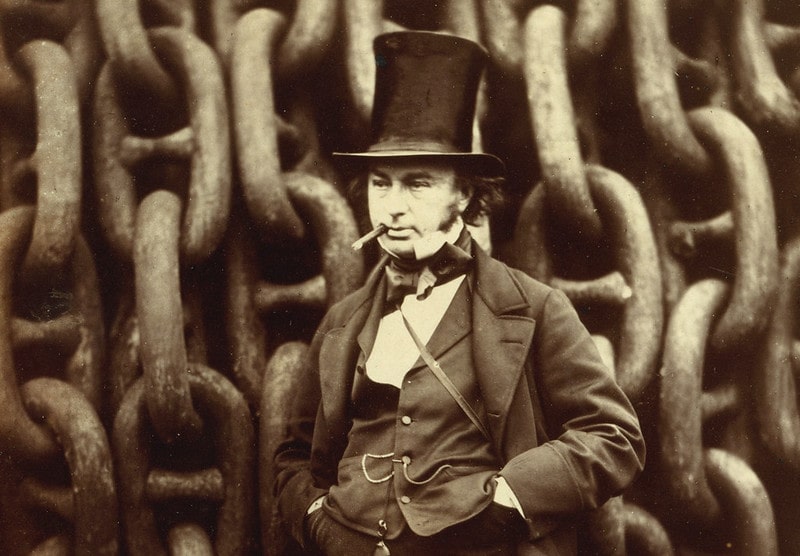 Black and white photograph of Isambard Kingdom Brunel, wearing a top hat and smoking.