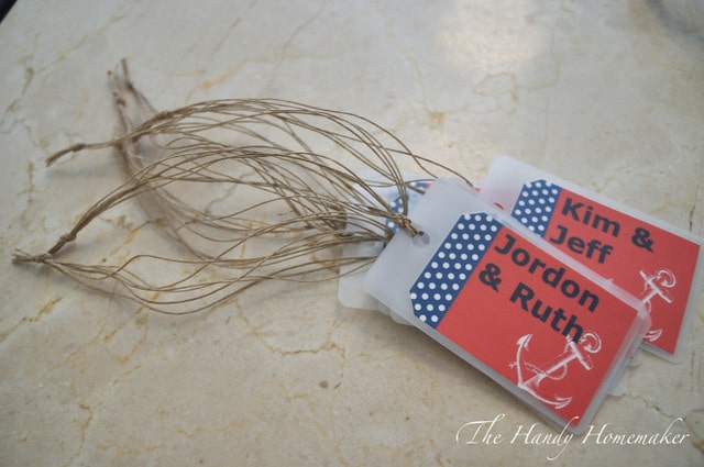 Laminated DIY luggage tag with twine threaded through.