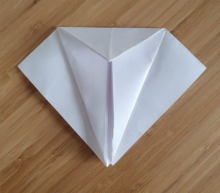 Step 2 to making an origami crow.