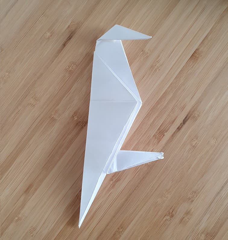 Step 7 to making an origami crow.