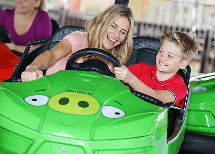 Mum and son in a dodgem car at King Pig's Wild Hog Dodgems.