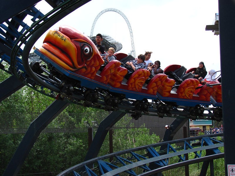 Kids and adults enjoying Flying Fish rollercoaster ride.