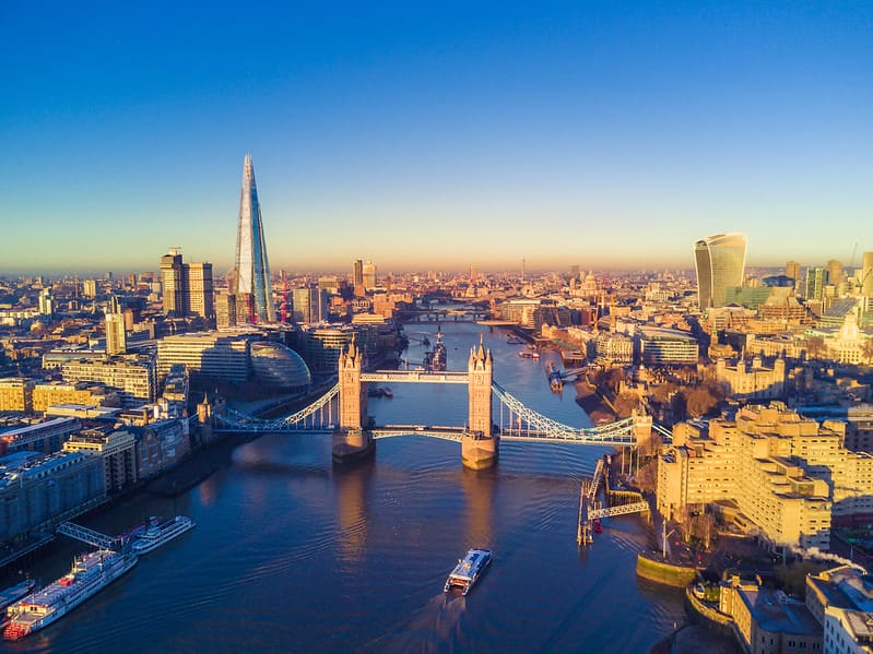 A panoramic view of the City of London with Tower Bridge as the central focus.