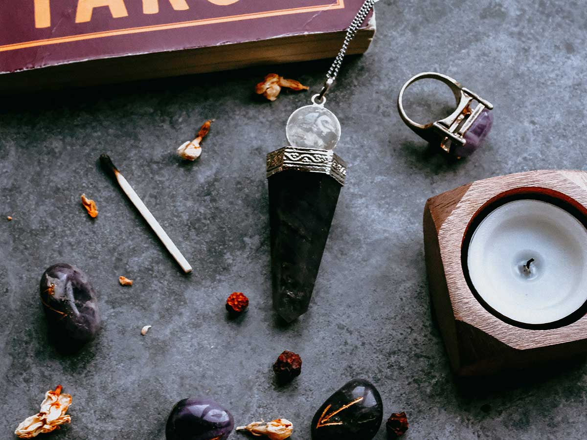 Crystal stones, rings, candles and matches - items for Anglo-Saxon spells and charms.