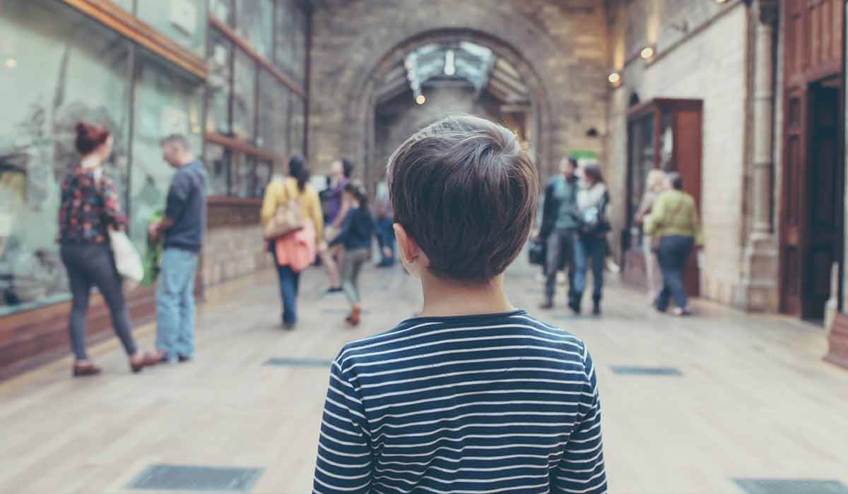 Young boy walking through the atrium in Horsham Gallery.