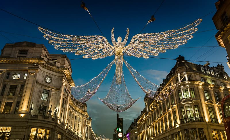 Christmas lights angel hanging on Regents Street, London.