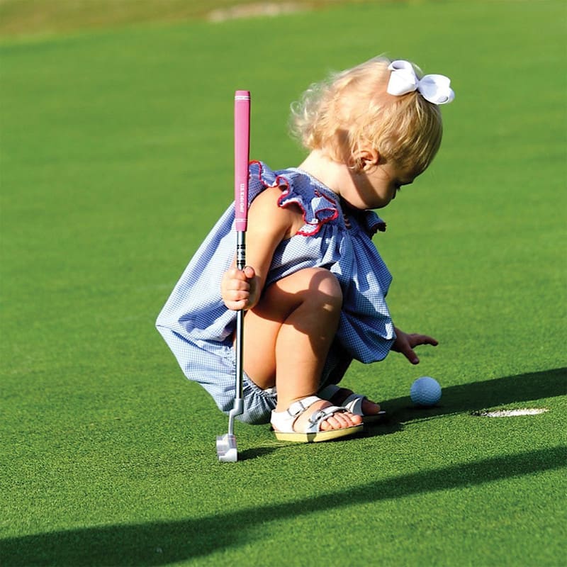 Little girl using US Kids Junior 1st Club Steel Shaft Putter.