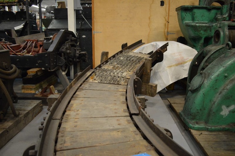 Parts of a spiral escalator on display.