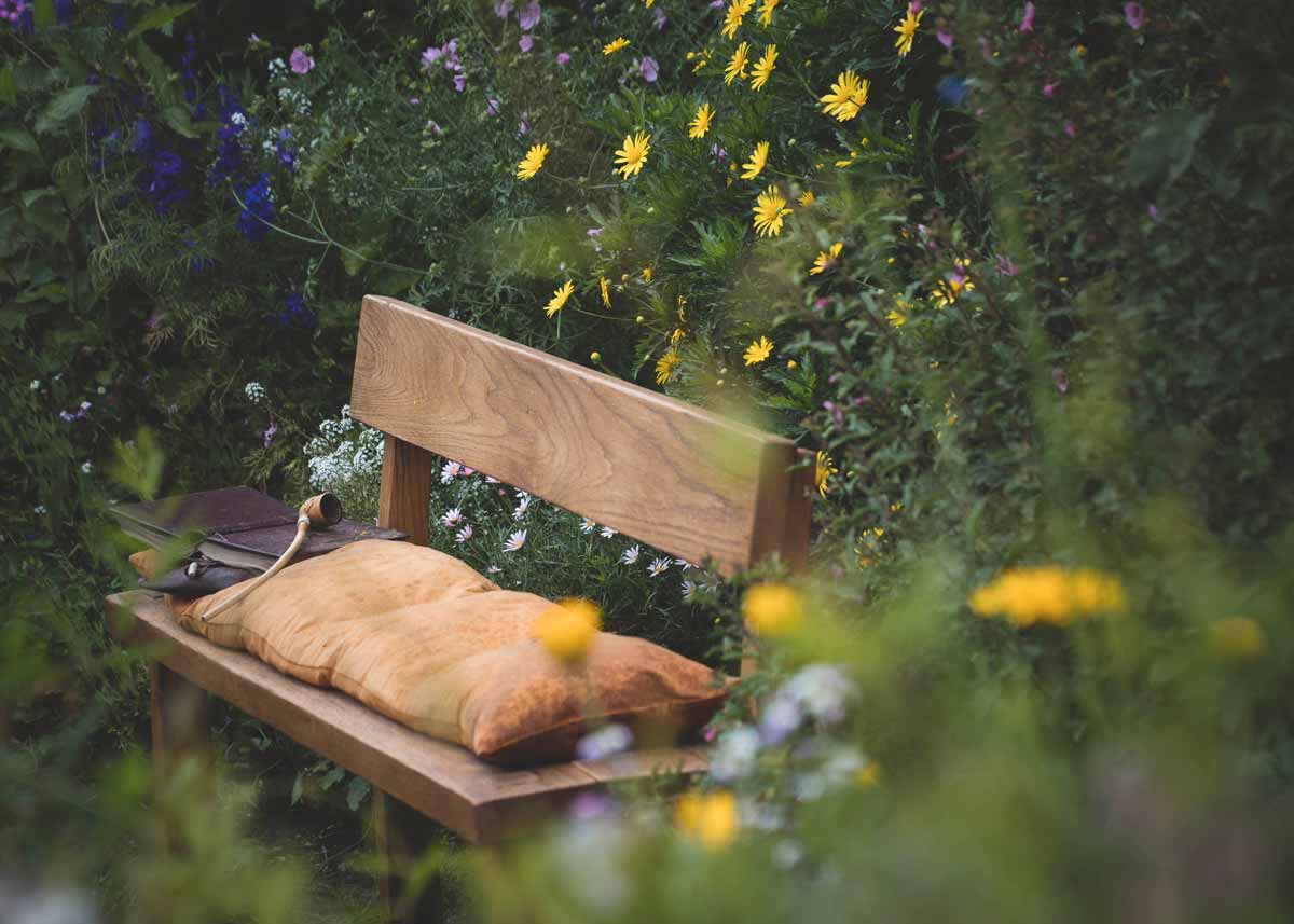 Bench in the Shire, from 'The Hobbit', with Bilbo Baggins' pipe and book resting on the side.