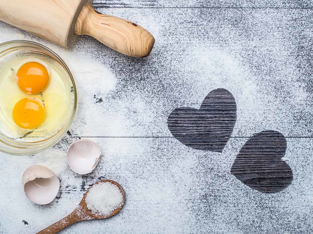 Ingredients and equipment needed to make a Pokemon cake, including eggs, flour and salt.