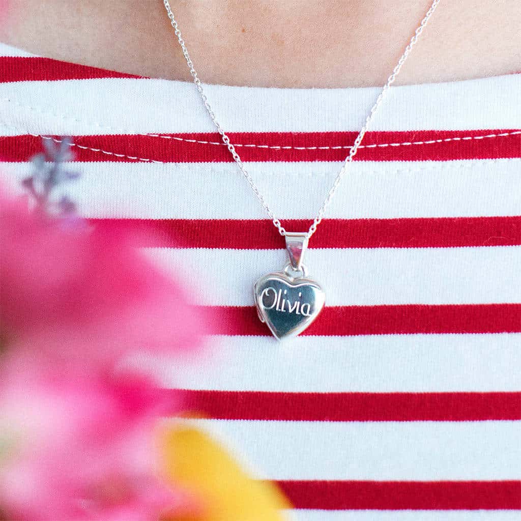 Personalized sterling silver heart locket for girls.