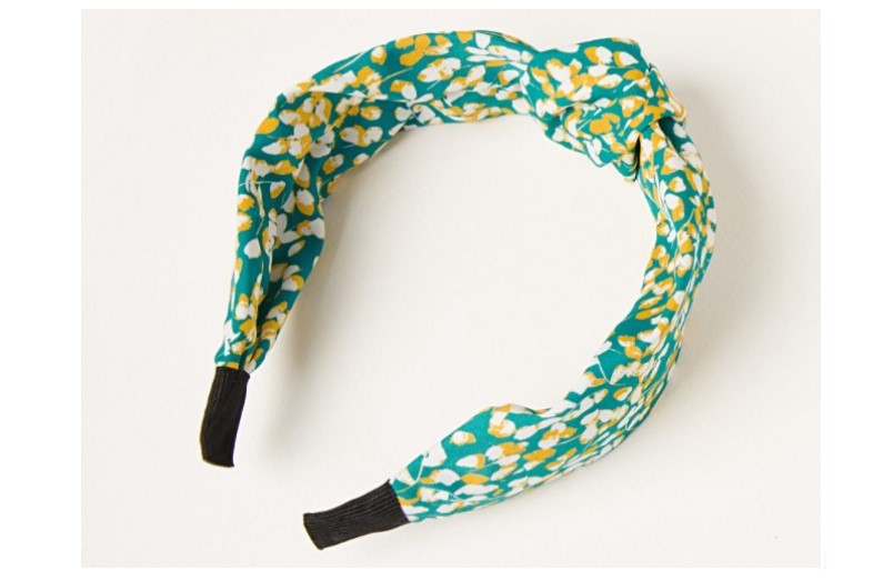 Headband with fresh floral design in blue.