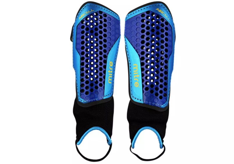 Mitre shin pads for protection when playing football.
