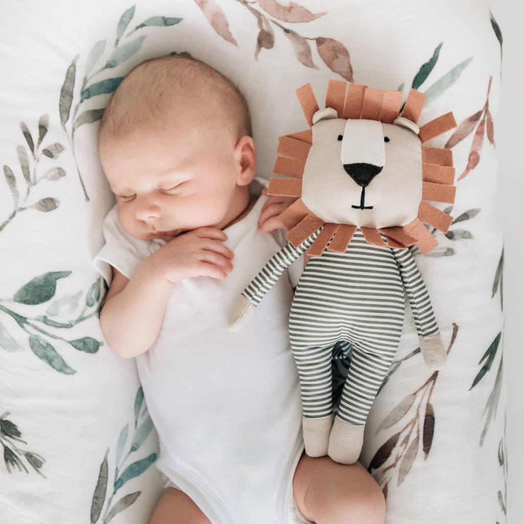 Little baby sleeping with strong and courageous Carson.