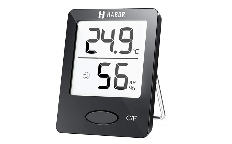 Mini black portable room thermometer and humidity meter.