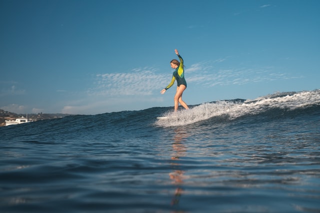 Female surfers have become increasingly common over time.