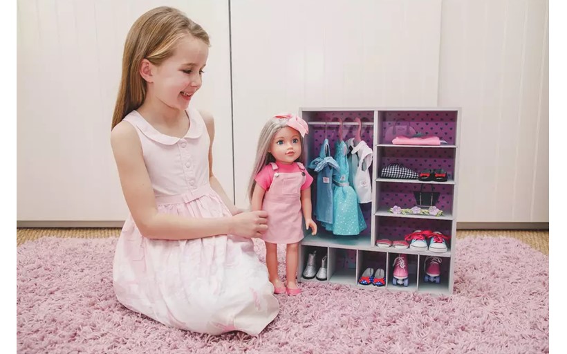 Cute mini doll closet with black polka dots design with several compartments for different doll's outfit.