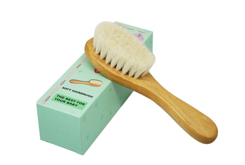 Hypoallergenic wooden with soft bristles brush made of goat's hair perfect for baby's hair grooming.