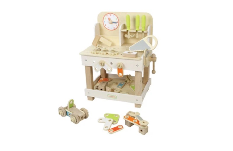 Cute soft colors wooden workbench with tools for kids.