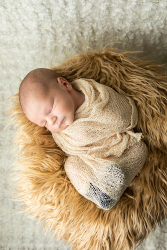 Redguard baby in blanket sleeping.