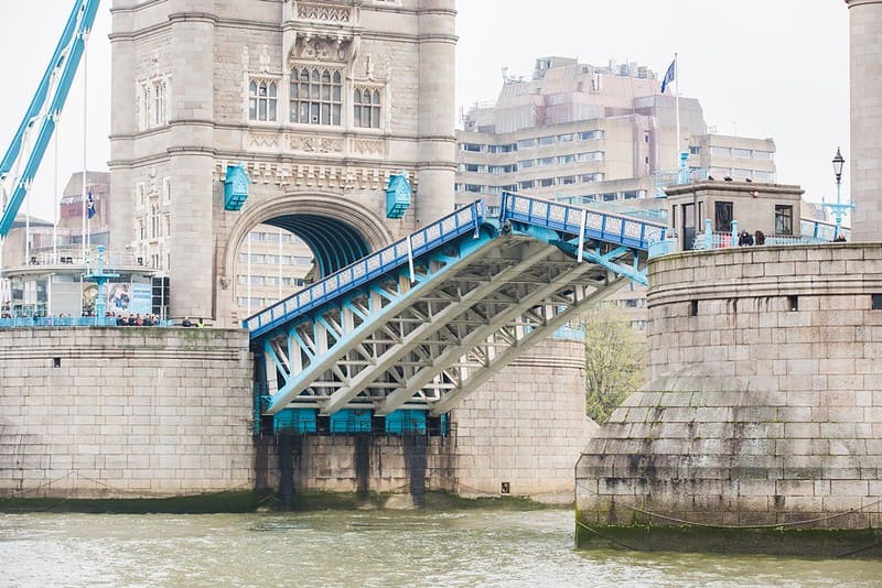 One of the bascules of Tower Bridge rising.