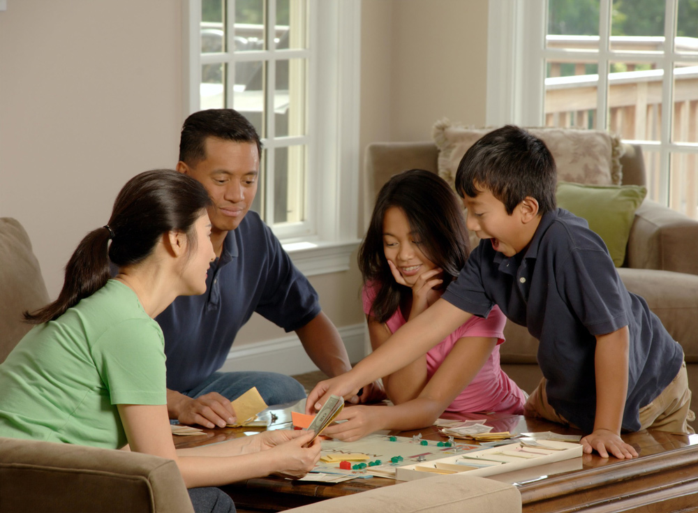 Family a playing board game togerher.