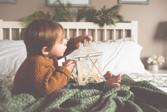 At 14 months, your child will be curious about everything.