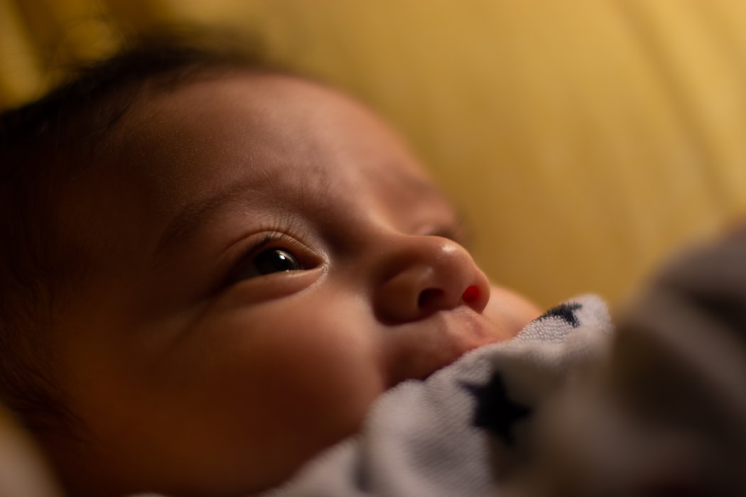 In week two you might notice your baby trying to focus on you.