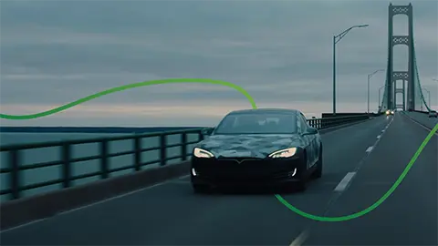 ev driving over bridge