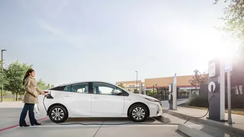 Women charging vehicle