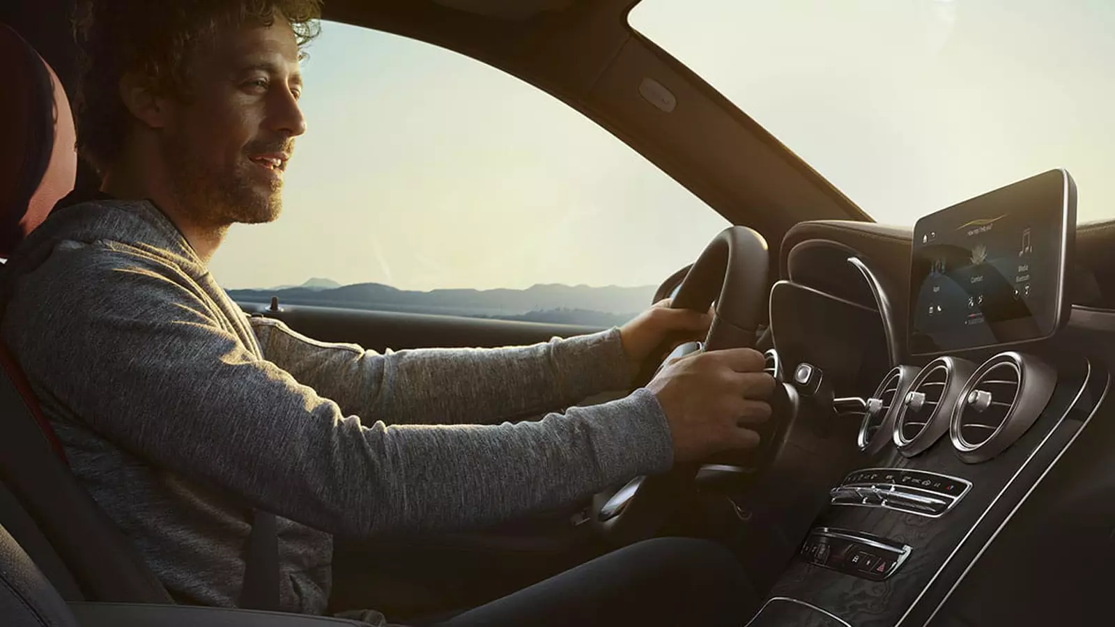 Man driving a Mercedes-Benz