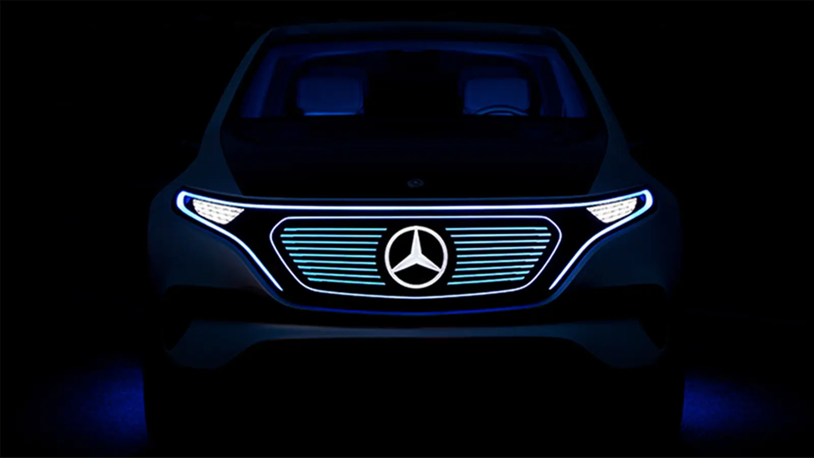 Mercedes-Benz in dark room with front lights on