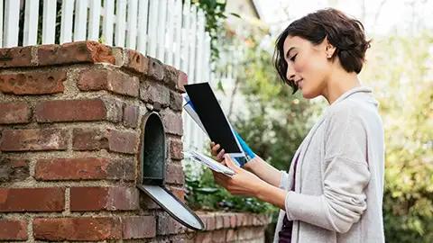 Woman checking her mail