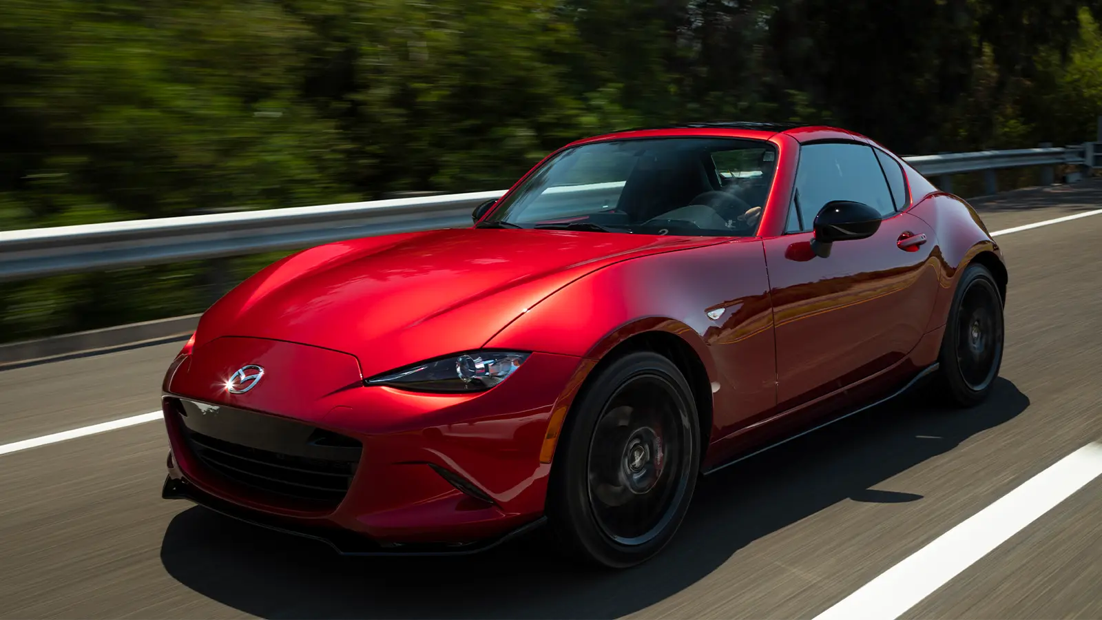 Red Mazda MX-5 Miata Driving on the Highway