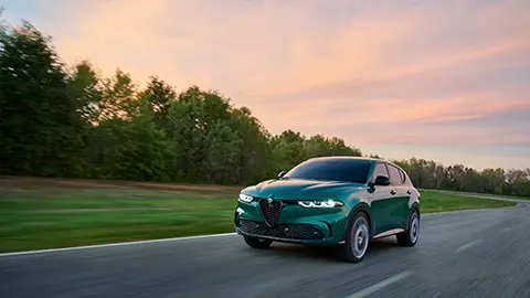 Plug-In Hybrid Alfa Romeo Tonale driving on the road 