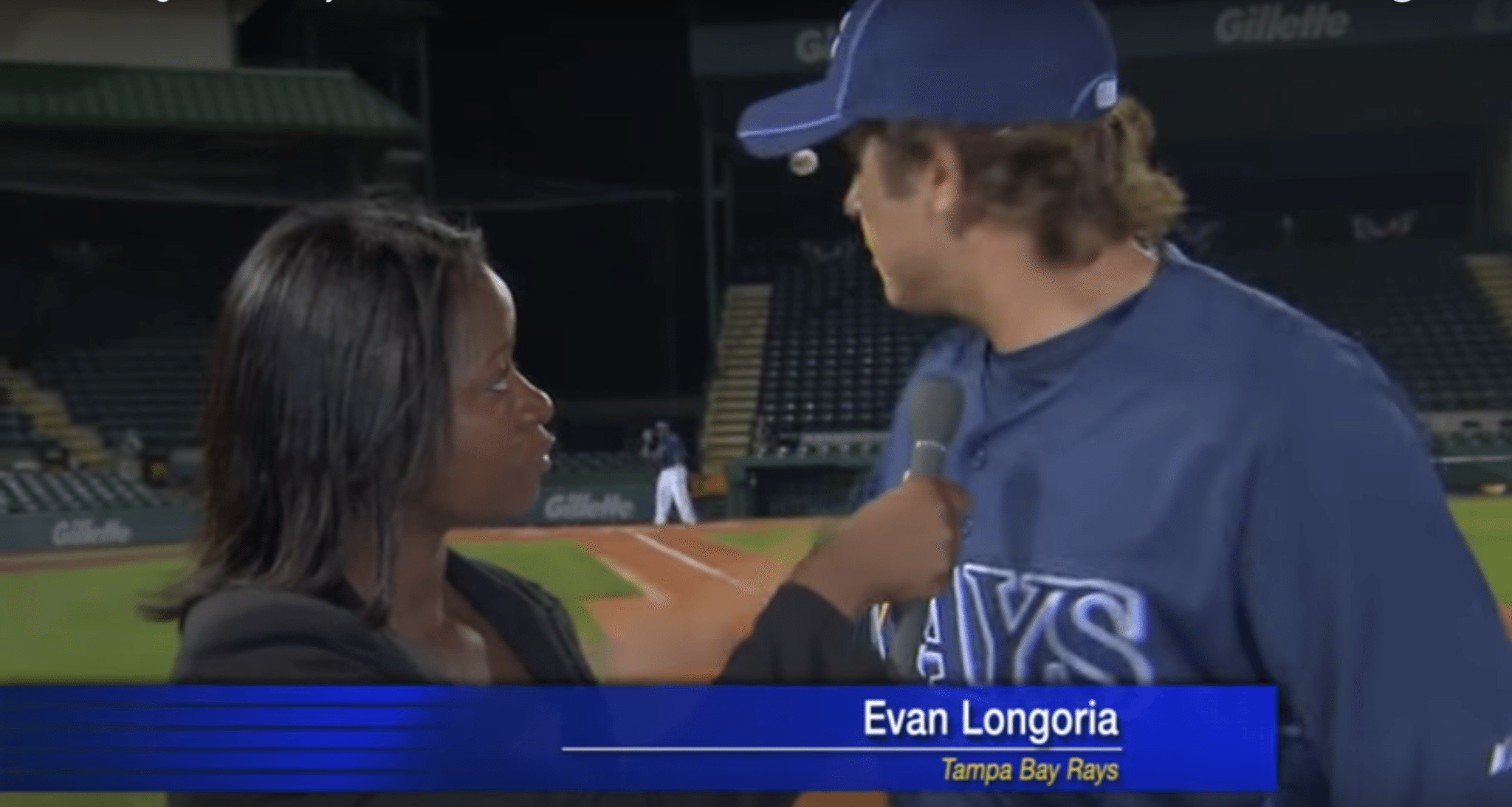 Evan longoria catches a ball during interview