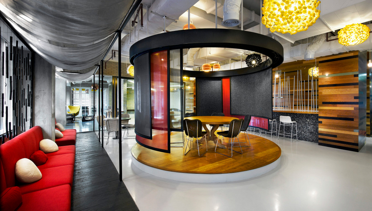 Elevated wood platform breakout space at Ogilvy's Jakarta office