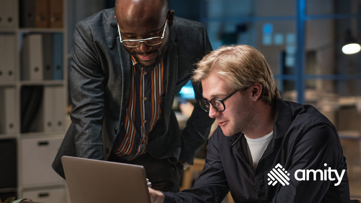 Developers looking at a computer