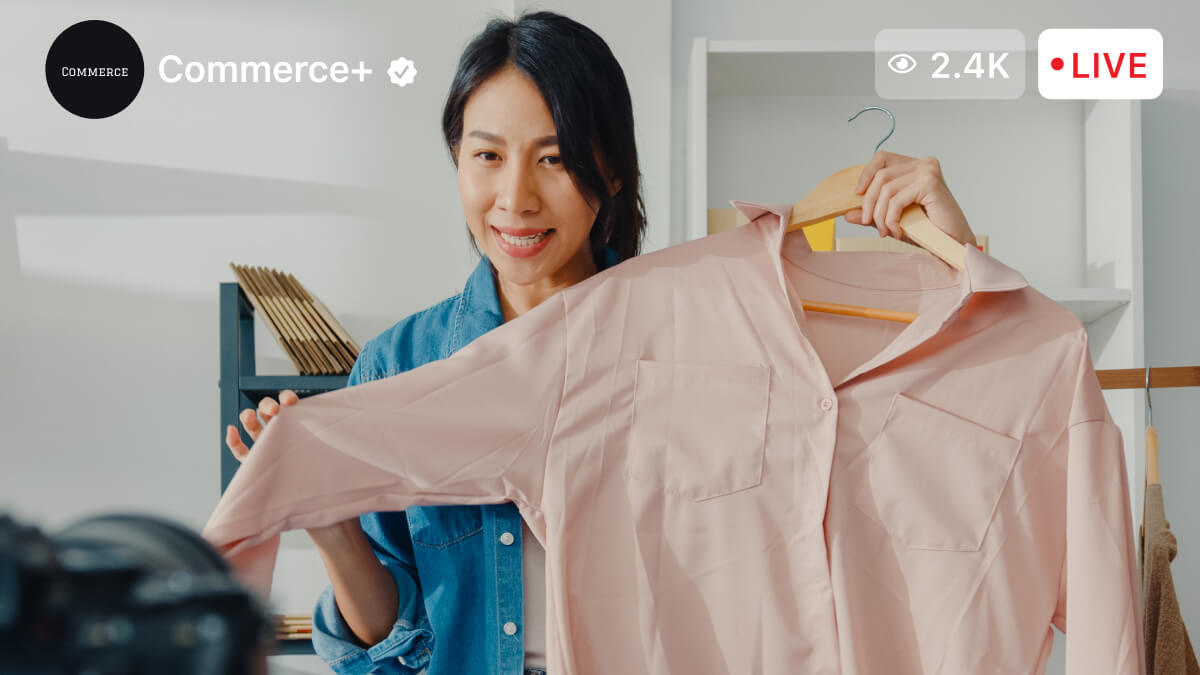 Woman hanging shirt on livestream