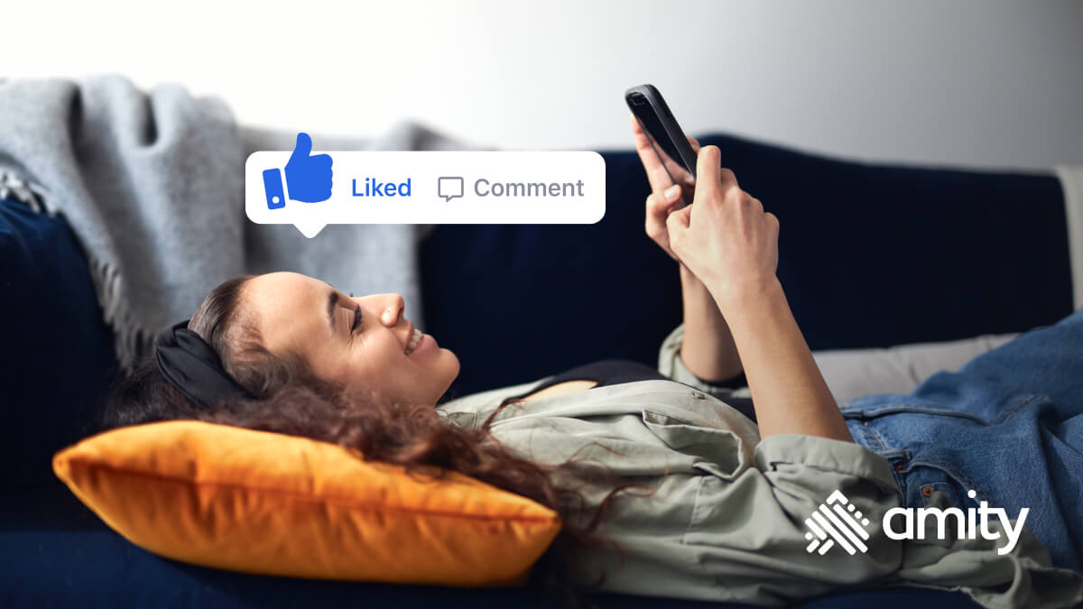 Girl with smartphone on couch engaging with a social media app