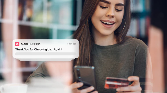 Woman getting a notification for completing online purchase